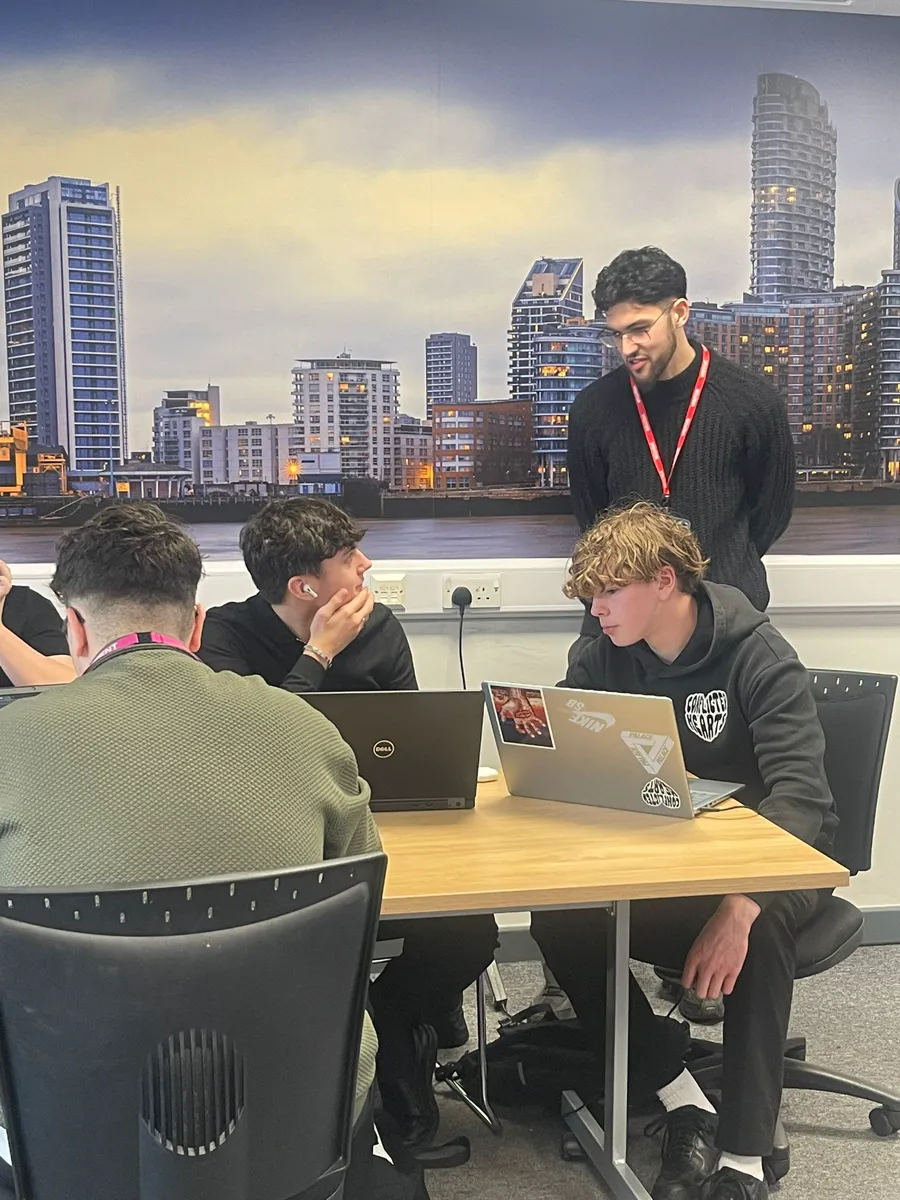 Harrez Aliane working with students during an AI Inclusion workshop